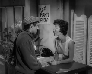 Seymour Krelboined and Audrey Fulquard are seen together by a desk.