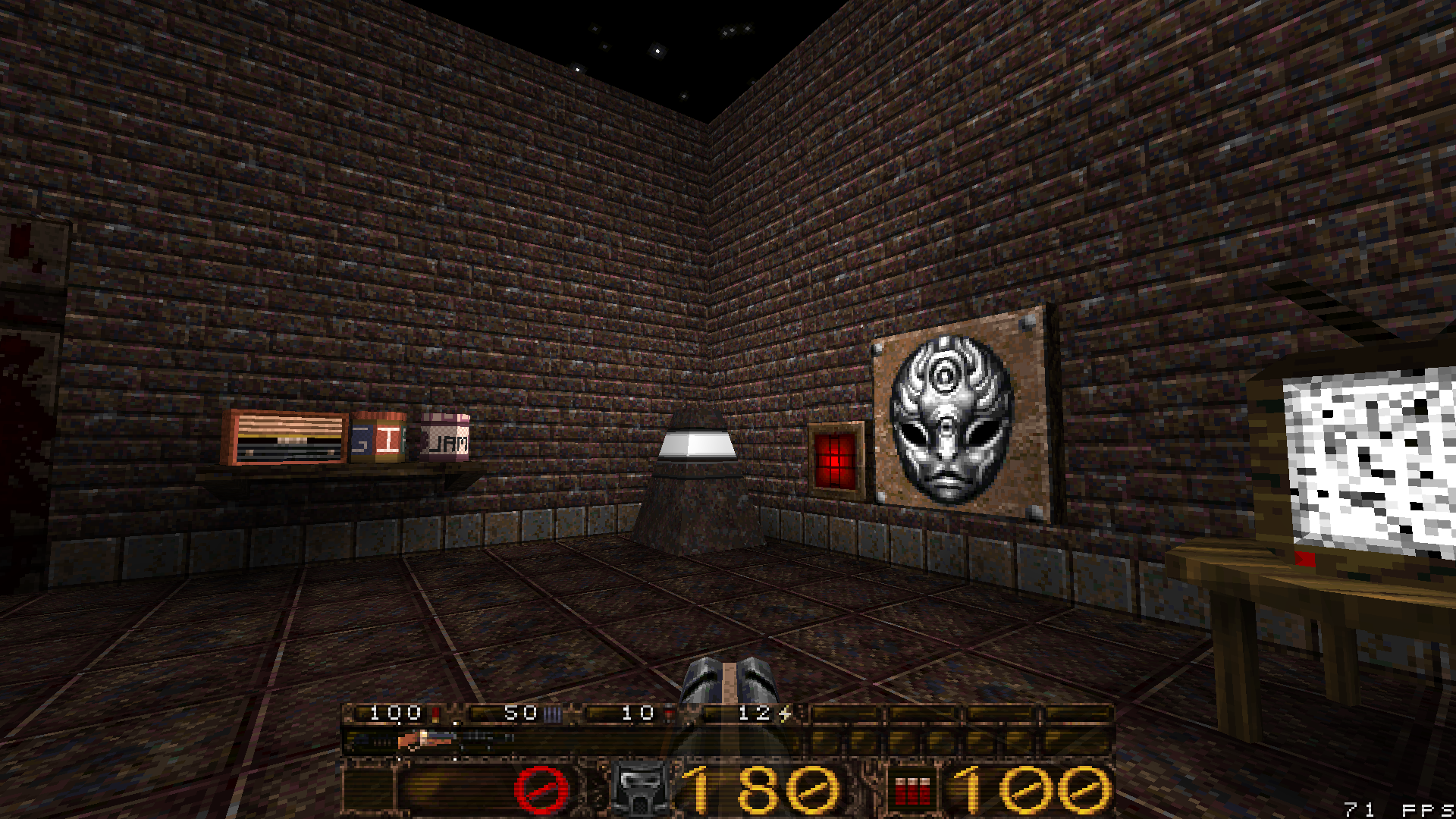 Screenshot of the game showing the player looking at a radio, a few jars, and a TV set. They have a gun in their hand.